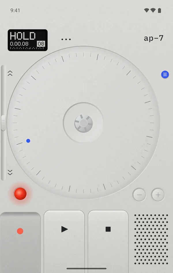 The cover screen with a finger on the reel while recording: the display reads HOLD 0.00.08.
