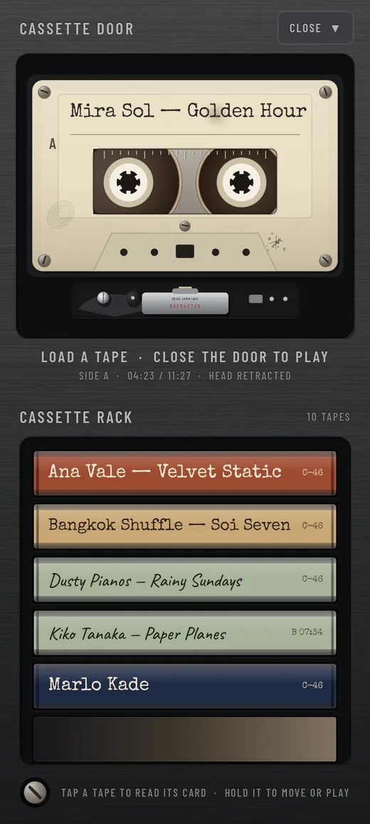 The open cassette door on an ordinary phone: CASSETTE DOOR with CLOSE at the top, the loaded tape lying flat in the deck, and the cassette rack below.