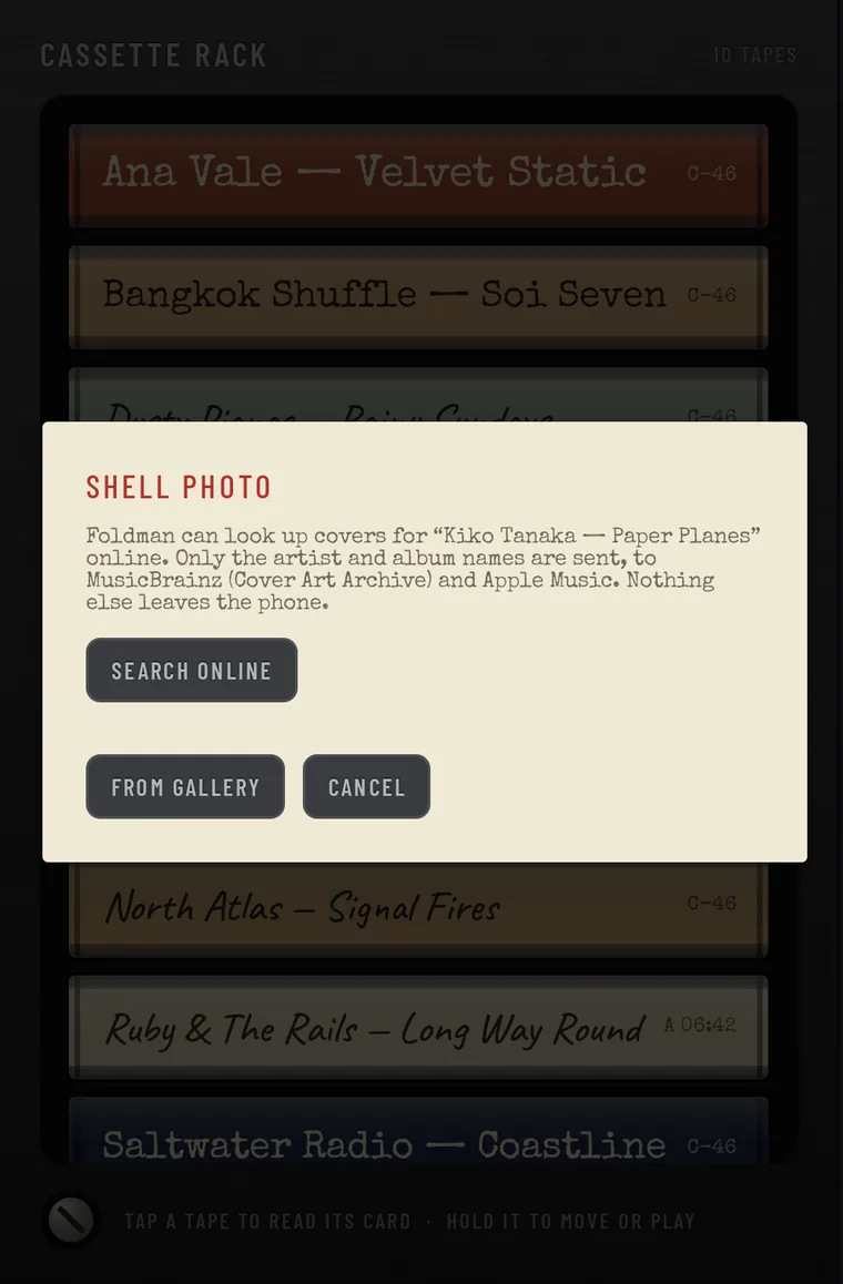 SHELL PHOTO: Foldman can look up covers for Kiko Tanaka, Paper Planes online. Only the artist and album names are sent, to MusicBrainz and Apple Music. Buttons SEARCH ONLINE, FROM GALLERY and CANCEL.